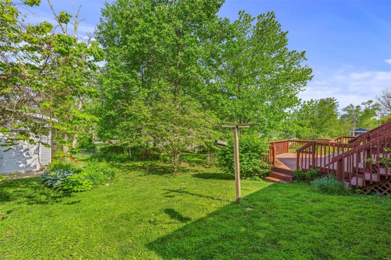 View of back yard featuring a deck