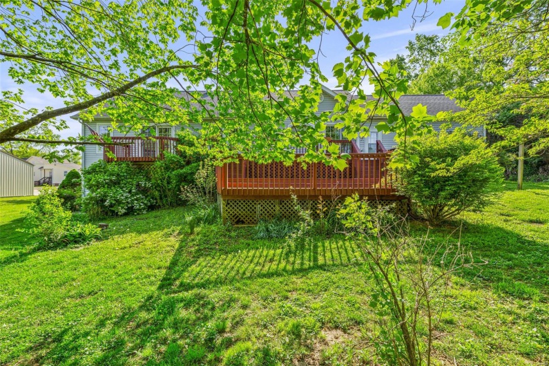 View of yard with a deck