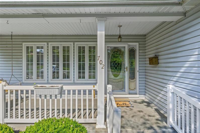 Property entrance with covered porch