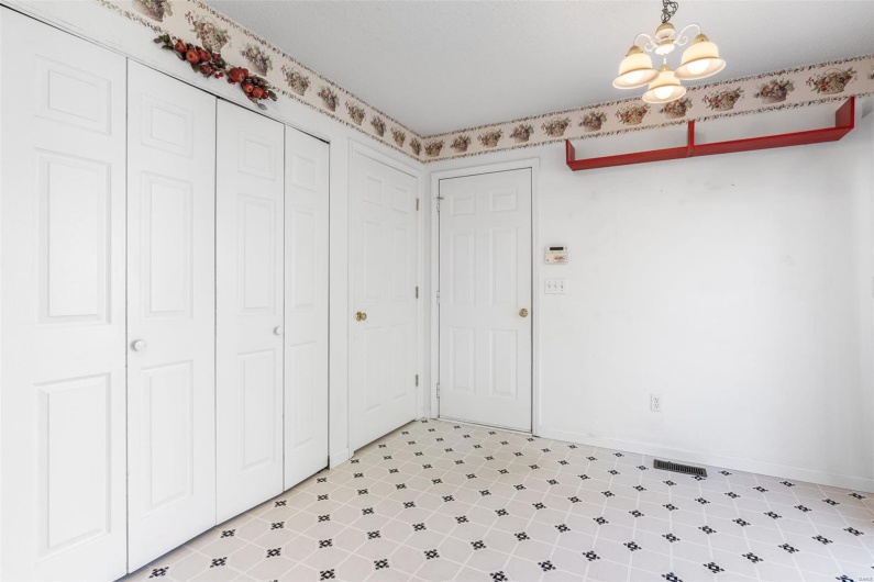 Breakfast area featuring an inviting chandelier and baseboards