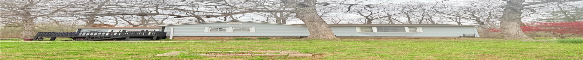 Residential For Sale Back of property featuring a wooden deck, a yard, and stairway