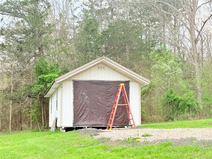 View of shed featuring a forest view
