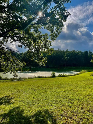 View of yard with a water view