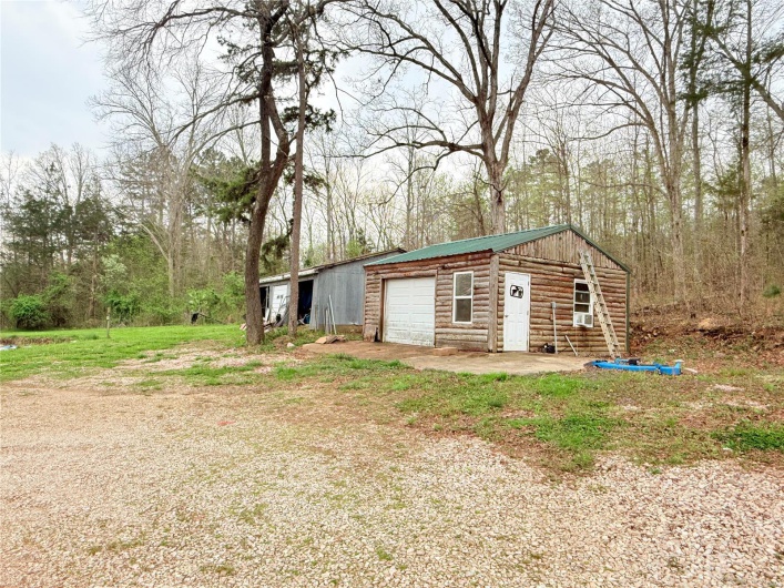 View of outbuilding with an outbuilding and driveway