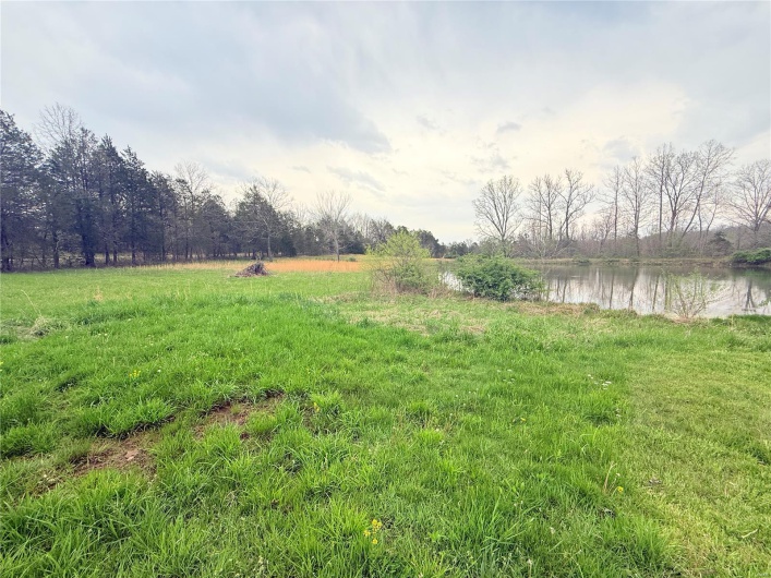 View of yard featuring a rural view and a water view