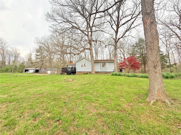 View of yard with a wooden deck