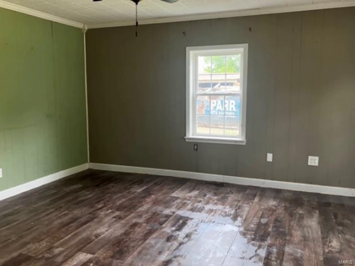 Bedroom featuring crown molding, dark wood-style flooring, ceiling fan, and baseboards