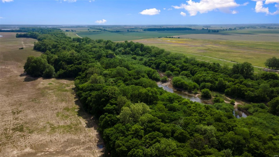 Birds eye view of property with a rural view