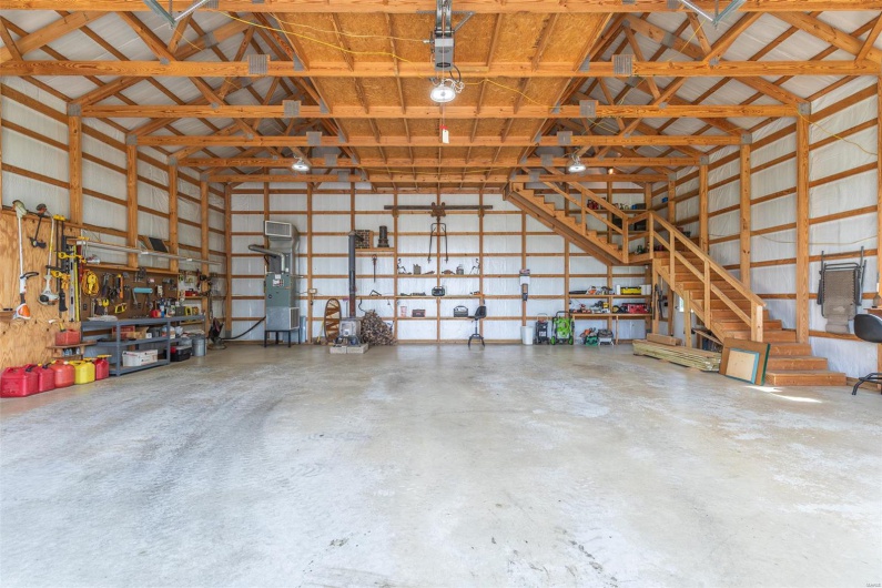 Garage with metal wall and a workshop area