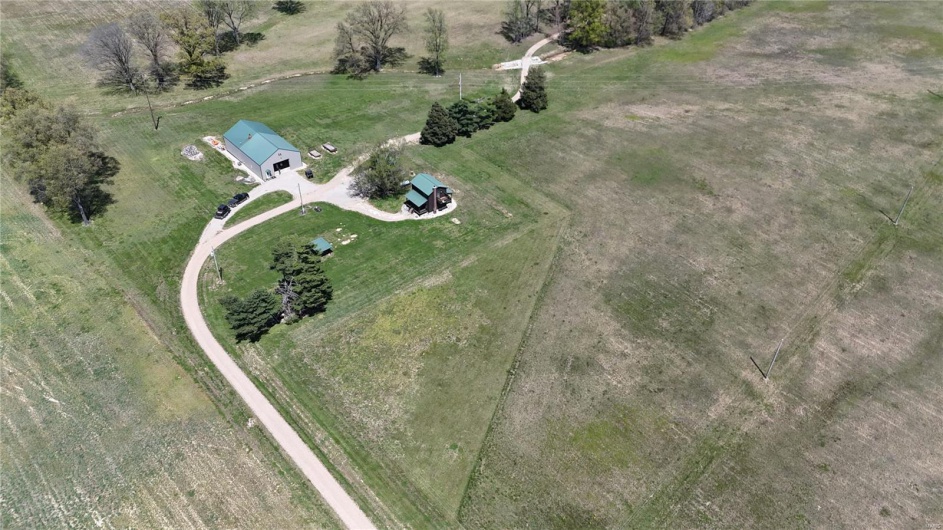 Birds eye view of property with a rural view
