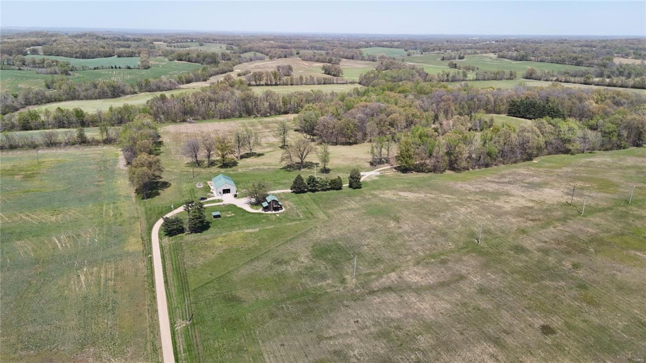 Birds eye view of property featuring a rural view
