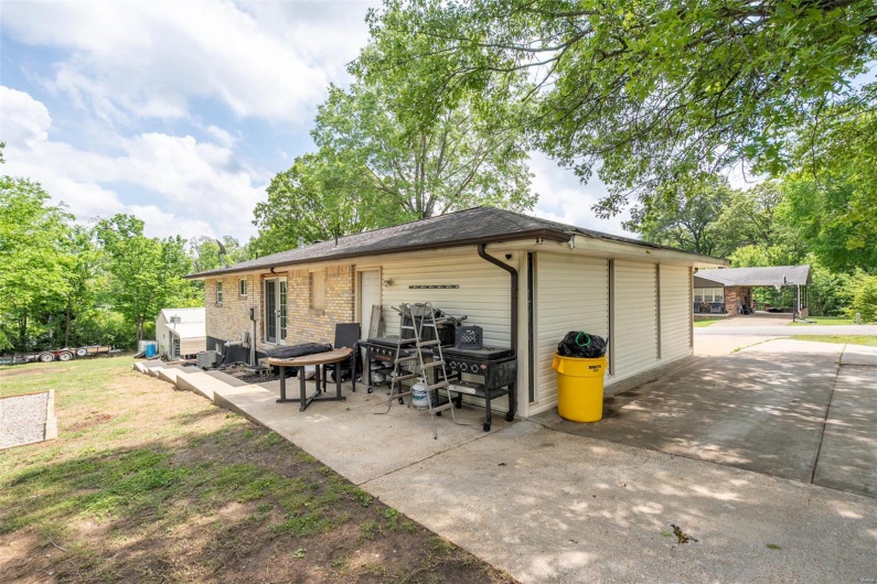 View of patio with a garage
