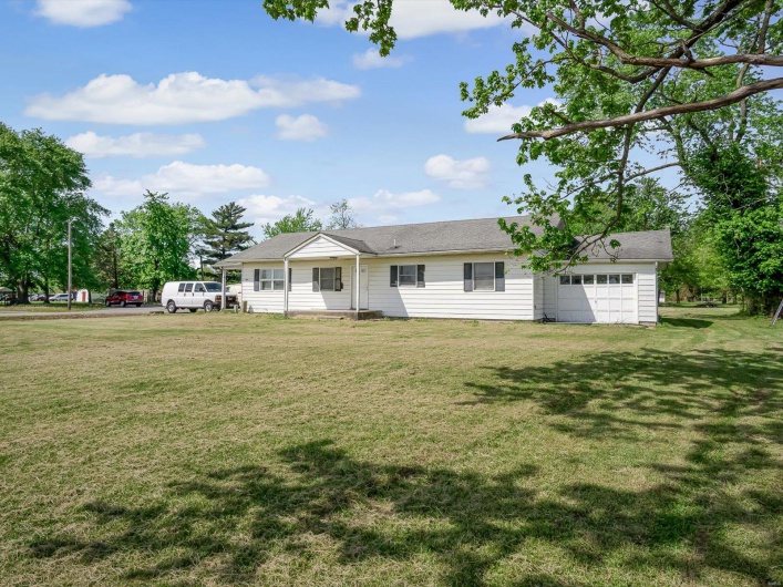 Single story home featuring a front yard