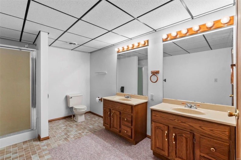Huge lower level full bath with walk-in shower and double vanity