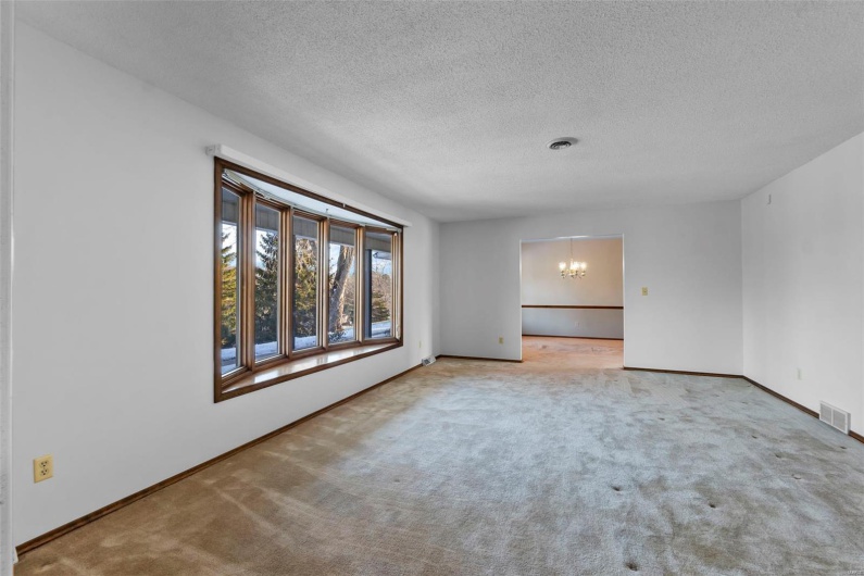Large bay window in spacious formal living room