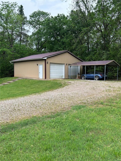 Garage featuring a detached garage
