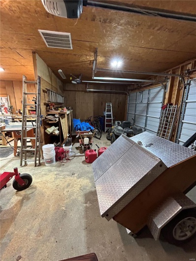 Garage featuring visible vents