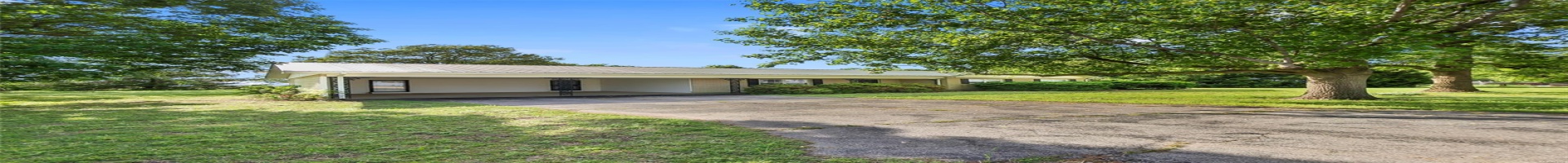 Residential For Sale Ranch-style home with an attached carport, driveway, metal roof, and a front lawn