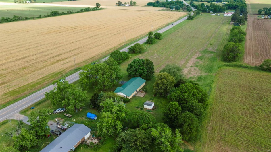 Birds eye view of property featuring a rural view