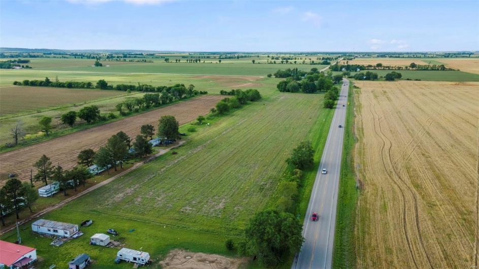 Birds eye view of property featuring a rural view