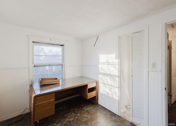 Unfurnished office with stone finish flooring