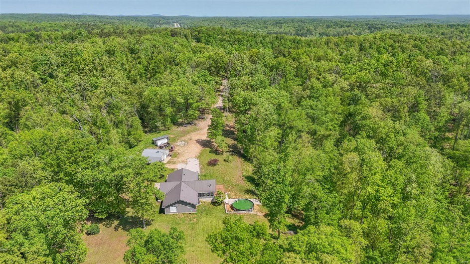 Bird's eye view featuring a view of trees