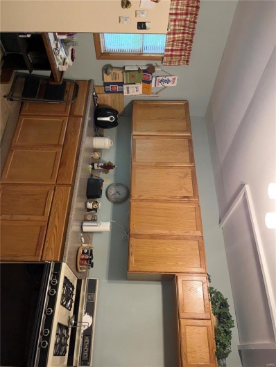 Kitchen with stove and refrigerator
