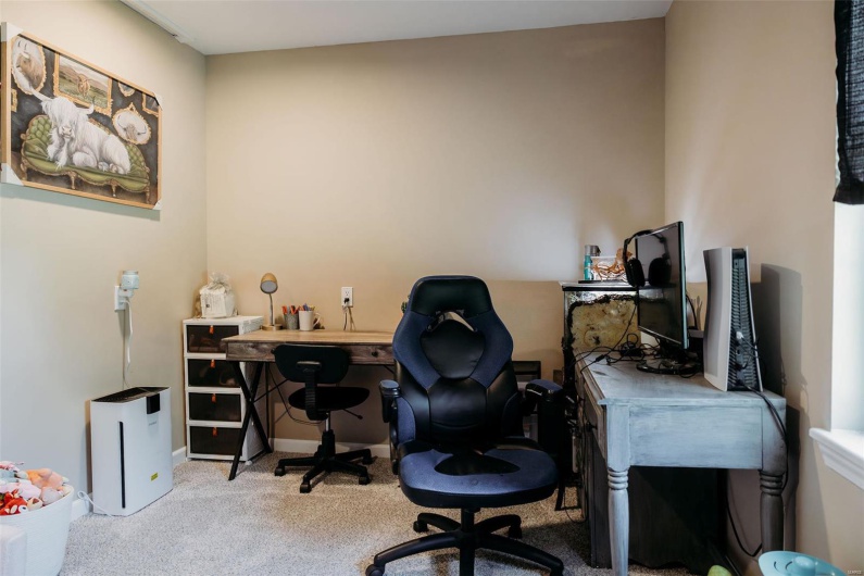 Home office featuring baseboards and carpet