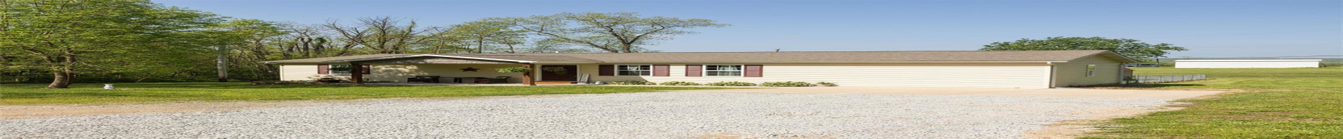Residential For Sale Ranch-style house with covered porch, driveway, and a front lawn