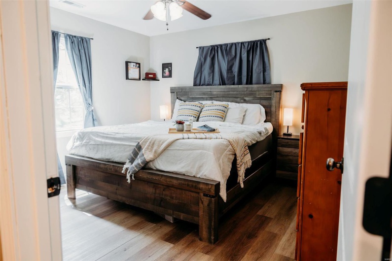Bedroom featuring a ceiling fan and wood finished floors