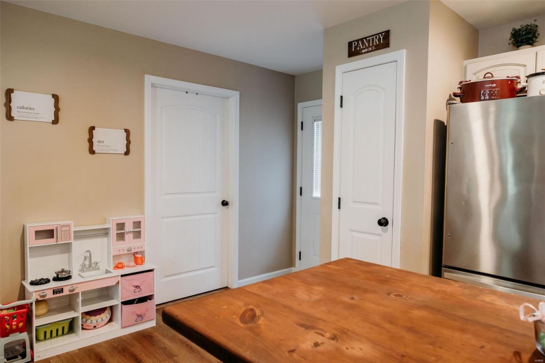Recreation room featuring baseboards and wood finished floors