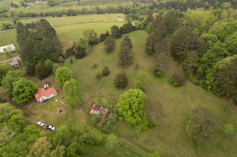 Birds eye view of property with a rural view