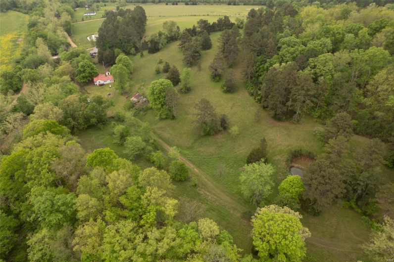 Birds eye view of property featuring a rural view