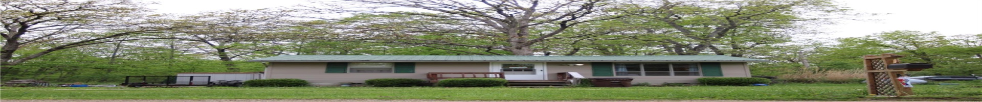 Residential For Sale Ranch-style house with a front lawn and metal roof