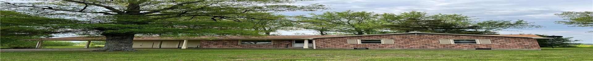 Residential For Sale View of front of house with driveway, a shingled roof, brick siding, and a front yard