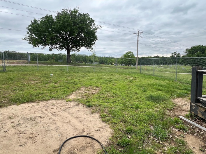 View of yard featuring fence