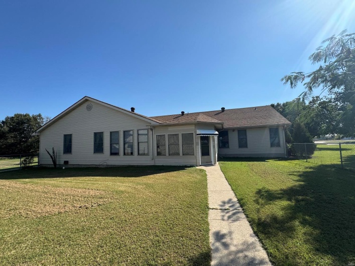View of front of house with a front yard