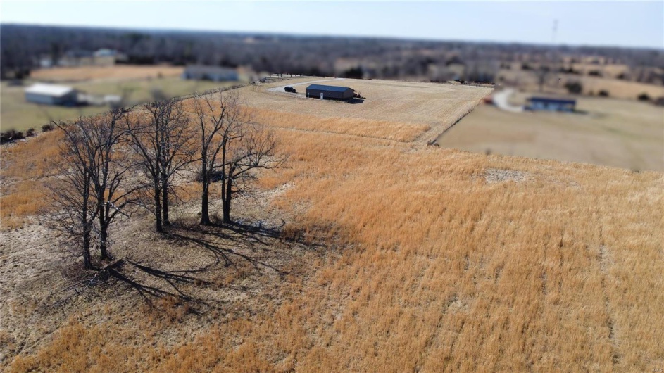 Birds eye view of property featuring a rural view