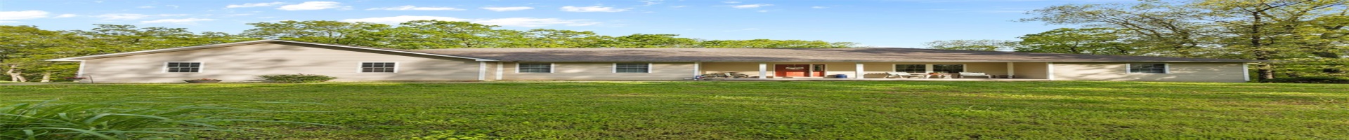 Residential For Sale Rear view of house with a lawn and a shingled roof