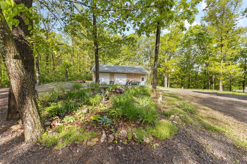 View of yard with a garage