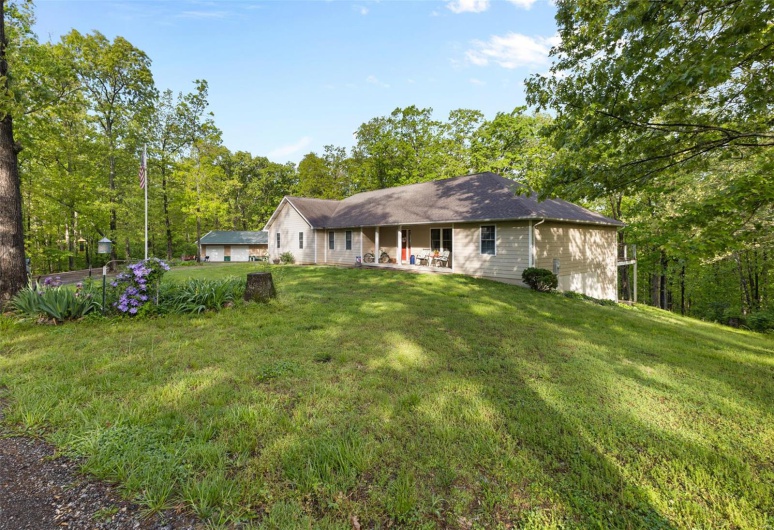 Back of house featuring a lawn
