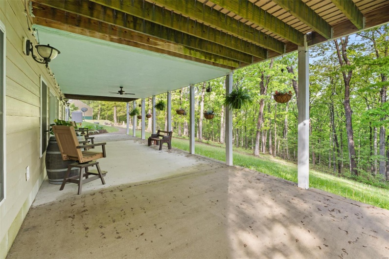 View of patio featuring ceiling fan