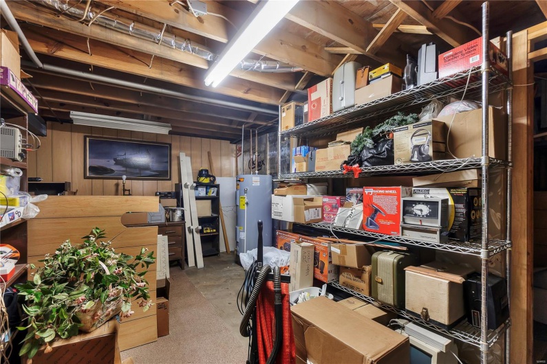 Storage area with electric water heater