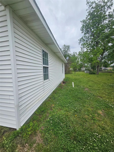 View of home's exterior featuring a yard