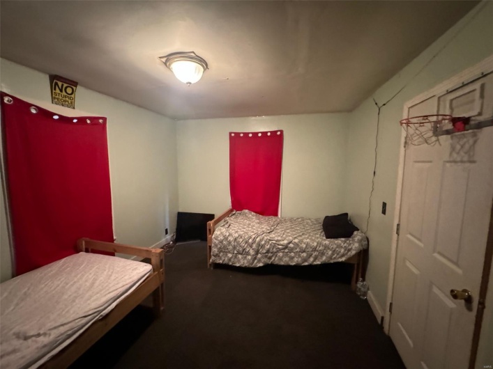 Carpeted bedroom with baseboards