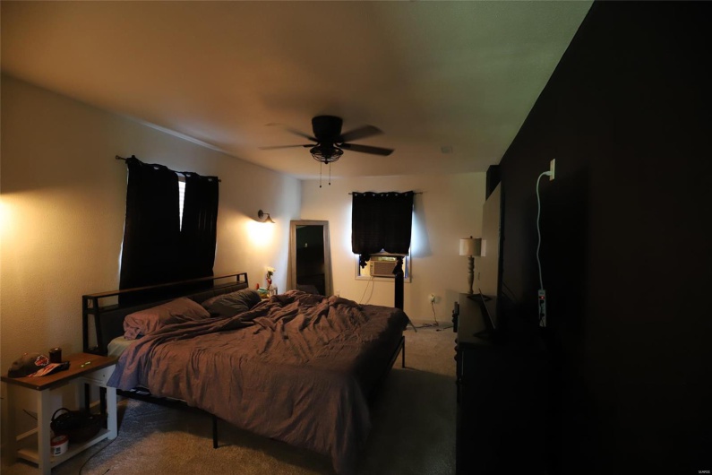 Master Bedroom has a window unit, Ceiling fan and spacious closet 