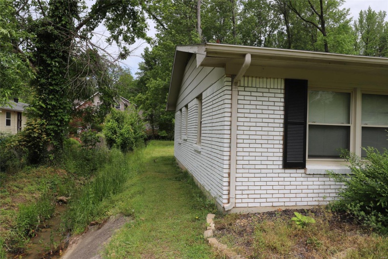 Left side of the Home has a weather creek along the side  