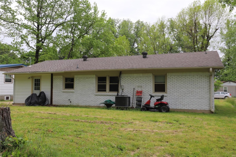 Back of the Home, Has Central Cooling system and rear door leading to the Laundry/Mud room