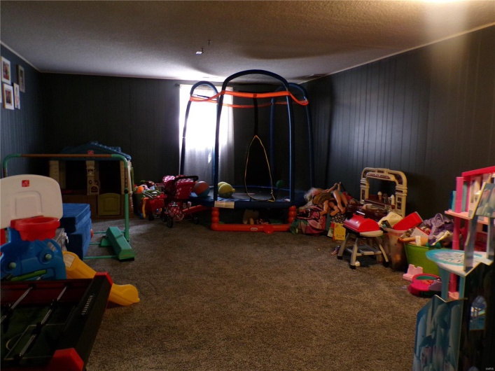 This room is currently being used as a huge playroom. 