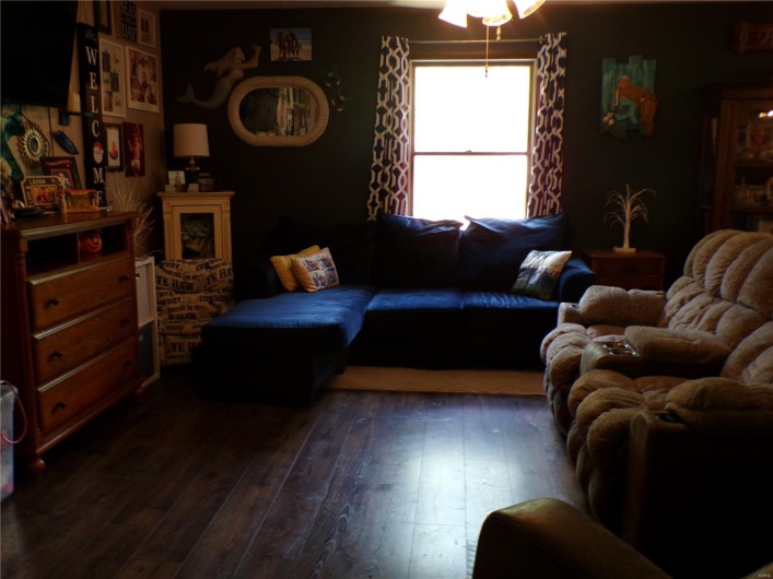 Living Room with vinyl floors, open floor plan with Dining Room and Kitchen